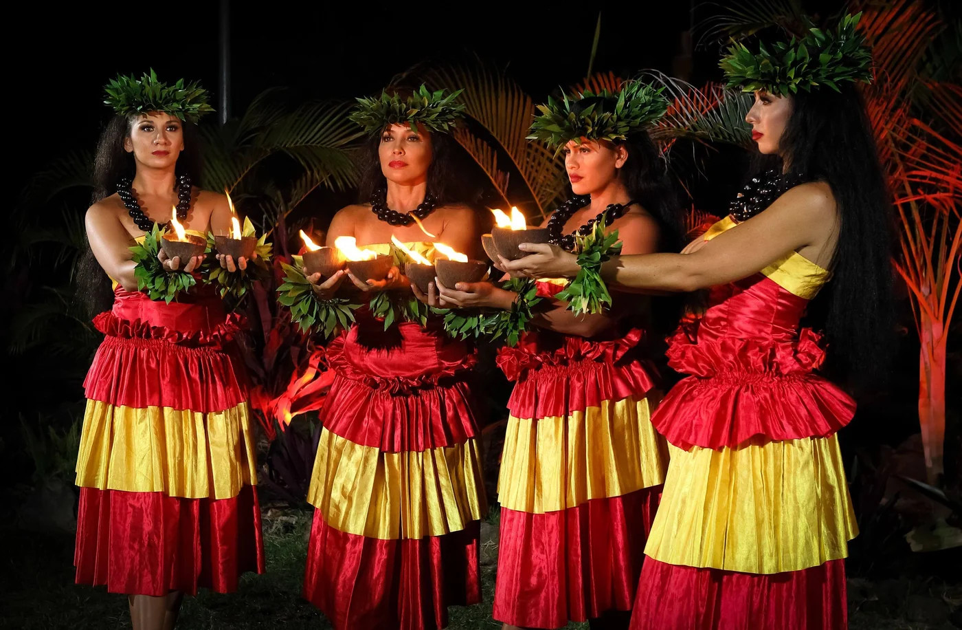 Aloha Kai Luau performers with flowers and lights